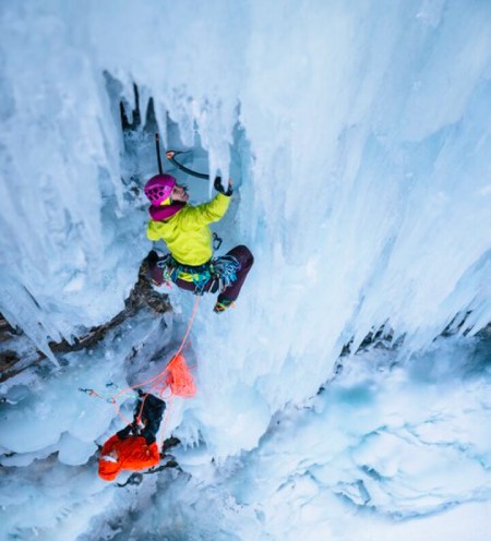 2 climbers scaling ice wall